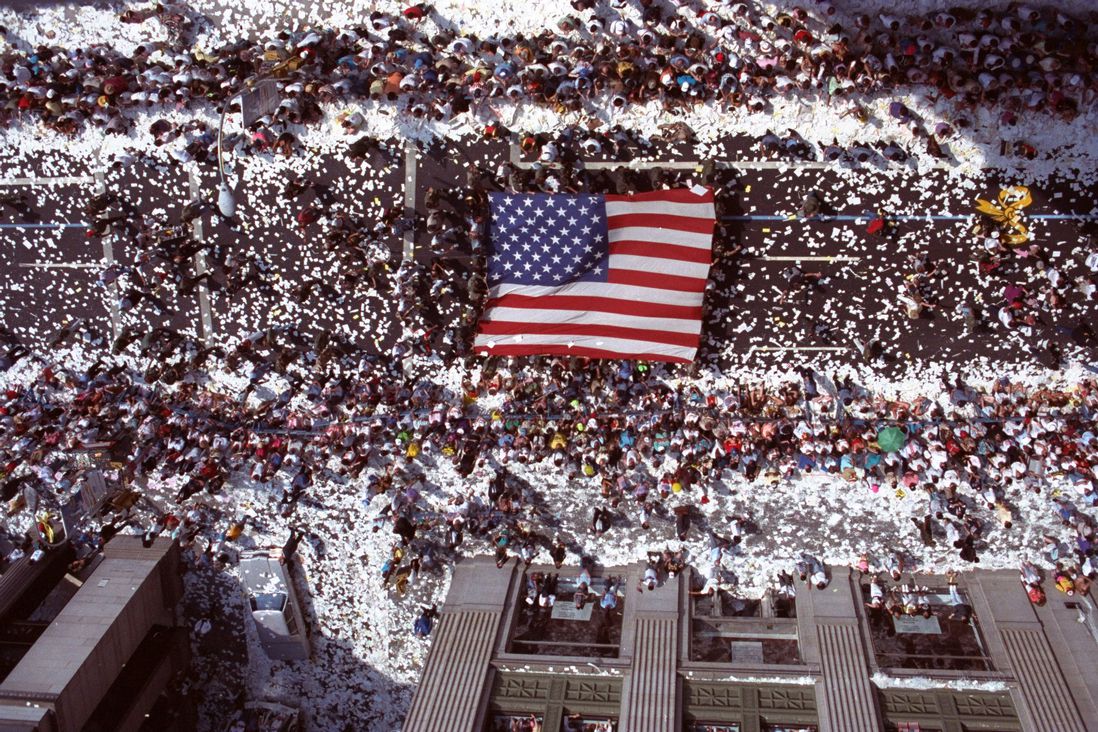 Marchers carry a giant American flag up Broadway in New York during Operation Welcome Home, the ticker-tape parade for returning veterans of Operation Desert Storm in 1991 (Ron Frehm/AP/Shutterstock)